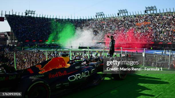 Second placed Lewis Hamilton of Great Britain and Mercedes celebrates on the podium after the F1 Grand Prix of Mexico at Autodromo Hermanos Rodriguez...