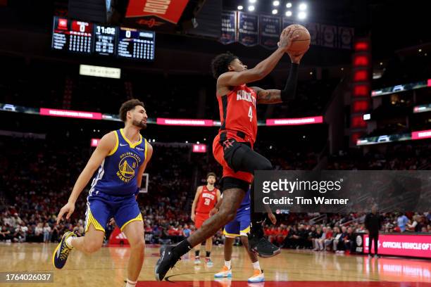 Jalen Green of the Houston Rockets drives to the basket while defended by Klay Thompson of the Golden State Warriors in the first half at Toyota...