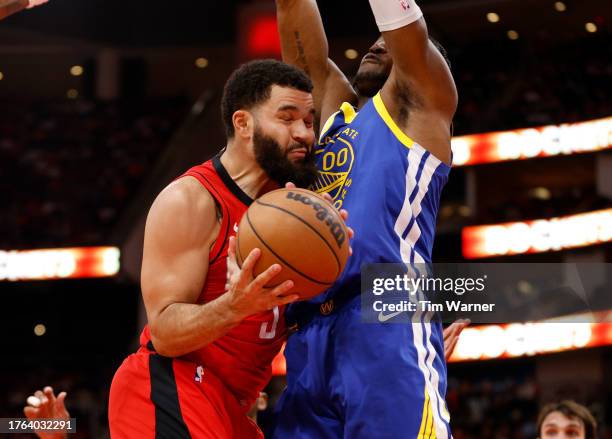 Jonathan Kuminga of the Golden State Warriors defends Fred VanVleet of the Houston Rockets in the first half at Toyota Center on October 29, 2023 in...