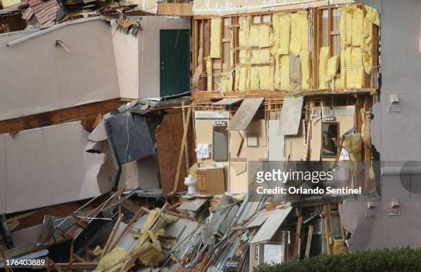Buildings collapse into a sinkhole at the Summer Bay Resort on U.S. Highway 192 in Clermont, Florida, Monday, August 12, 2013. Guests had only 10 to...