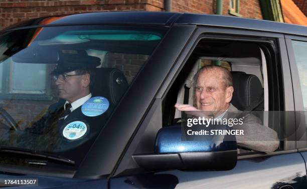 Britain's Prince Philip is driven from Papworth Hospital in Cambridgeshire on December 27, 2011 after receiving treatment and spending four nights...