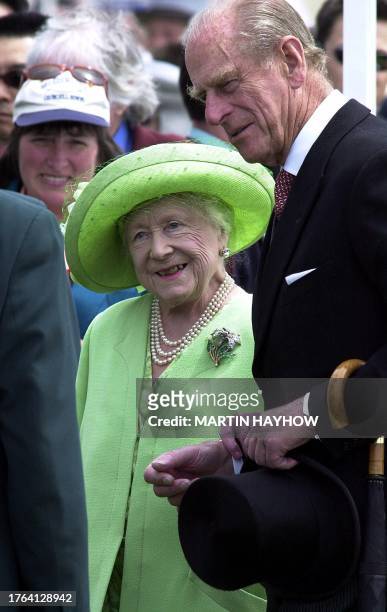 Britain's Queen Elizabeth the Queen Mother supported by her son in law, Prince Phillip the Duke of Edinburgh arrives at Epsom on Derby day, 10 June...