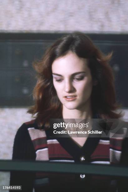 Close-up of American heiress Patty Hearst as she is escorted from her holding cell during her trial for her role in the robbery of the Sunset...