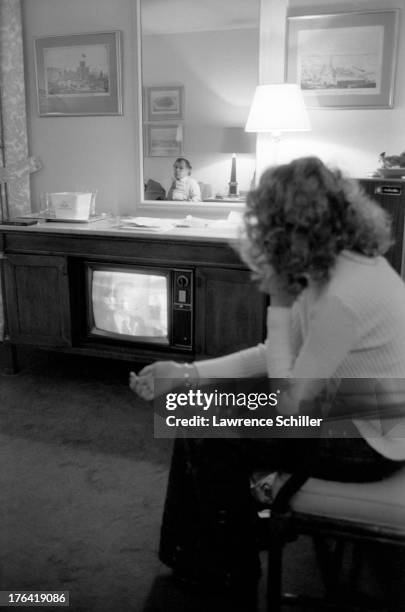 View of American attorney F. Lee Bailey and his wife Lynda Hart watch television in their room at the Stanford Court hotel, San Francisco,...