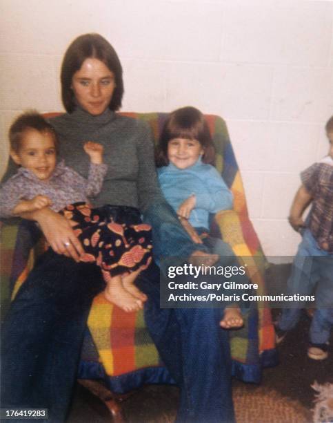 Portrait of American teenage mother Nicole Baker with her two children, Sonny and Jeremy, 1977. Baker dated and lived with convicted felon and later...