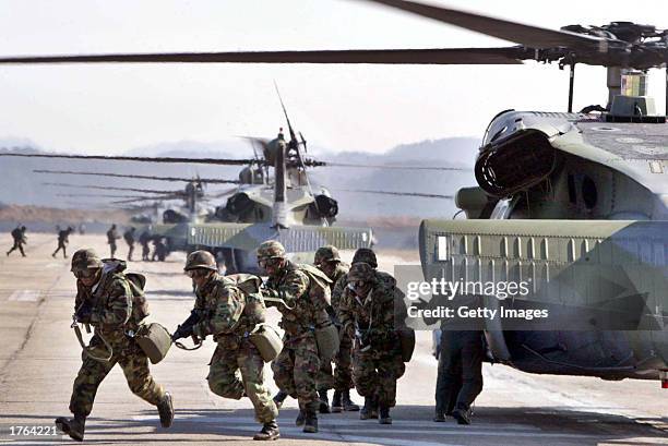 South Korean soldiers run during a military exercise February 6, 2003 in Yeonki, south of Seoul, South Korea. North Korea warned pre-emptive attacks...