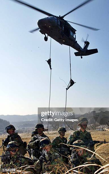 South Korean soldiers lower themselves from a helicopter during a military exercise February 6, 2003 in Yeonki, south of Seoul, South Korea. North...