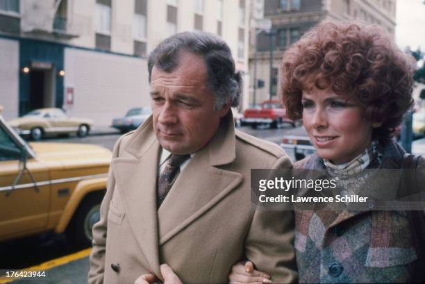 American attorney F. Lee Bailey and his wife Lynda Hart walk arm in arm along a sidewalk, San Francisco, California, 1976. At the time, Bailey was...