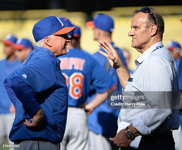 Terry Collins of the New York Mets talks with Joe Torre before the game against the Los Angeles Dodgers at Dodger Stadium on August 12, 2013 in Los...