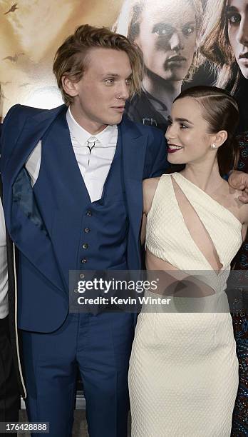 Actors Jamie Campbell Bower and Lily Collins attend the premiere of Screen Gems & Constantin Films' "The Mortal Instruments: City of Bones" at...