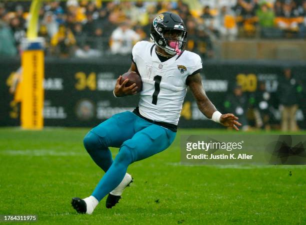 Travis Etienne Jr. #1 of the Jacksonville Jaguars in action against the Pittsburgh Steelers on October 28, 2023 at Acrisure Stadium in Pittsburgh,...