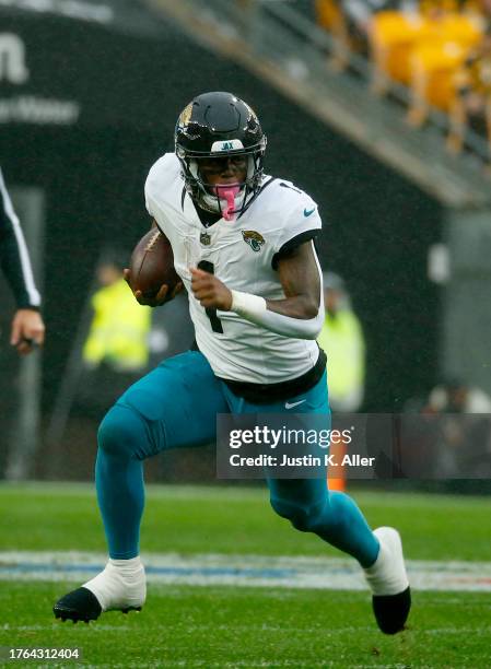 Travis Etienne Jr. #1 of the Jacksonville Jaguars in action against the Pittsburgh Steelers on October 28, 2023 at Acrisure Stadium in Pittsburgh,...