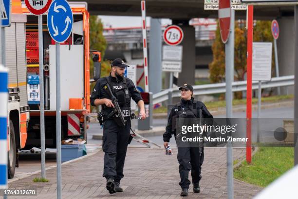 Police officers near the terminal Tango at Hamburg Airport on November 5, 2023 in Hamburg, Germany. Police are currently in a standoff with an armed...