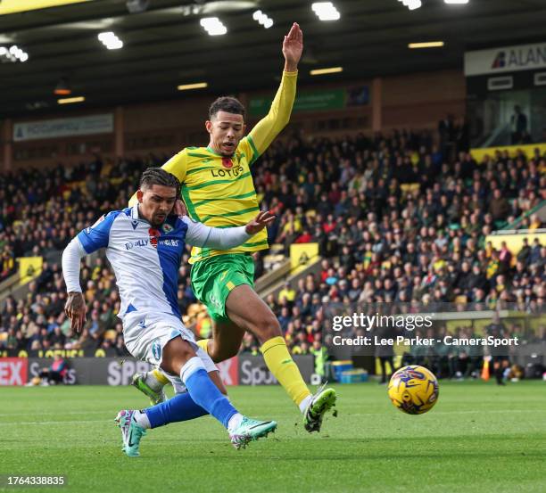 Blackburn Rovers' Tyrhys Dolan scores the opening goal despite the attentions of Norwich City's Jaden Warner during the Sky Bet Championship match...
