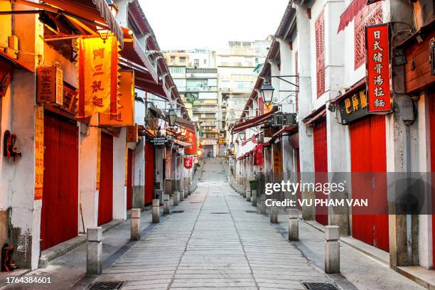 early morning in macau city street still life with a vanishing point - macao stock pictures, royalty-free photos & images