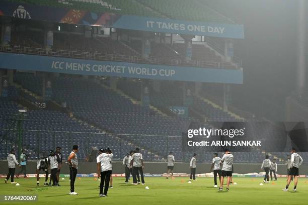 Sri Lanka's players attend a practice session amid smoggy conditions on the eve of their 2023 ICC Men's Cricket World Cup one-day international match...