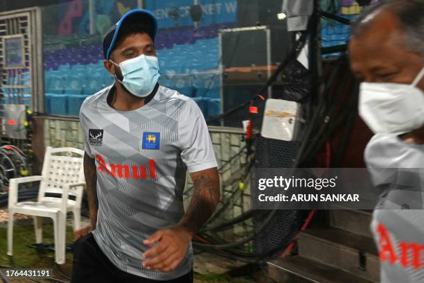 Sri Lanka's captain Kusal Mendis wearing a facemask arrives for a practice session amid smoggy conditions on the eve of their 2023 ICC Men's Cricket...