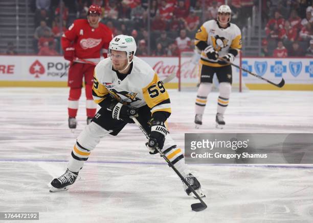Jake Guentzel of the Pittsburgh Penguins skates against the Detroit Red Wings at Little Caesars Arena on October 18, 2023 in Detroit, Michigan.