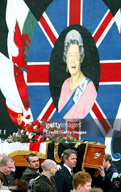 Protestants carry the flag-draped body of slain Ulster Defense Association Commander John Gregg February 6, 2003 in Belfast, Northern Ireland....