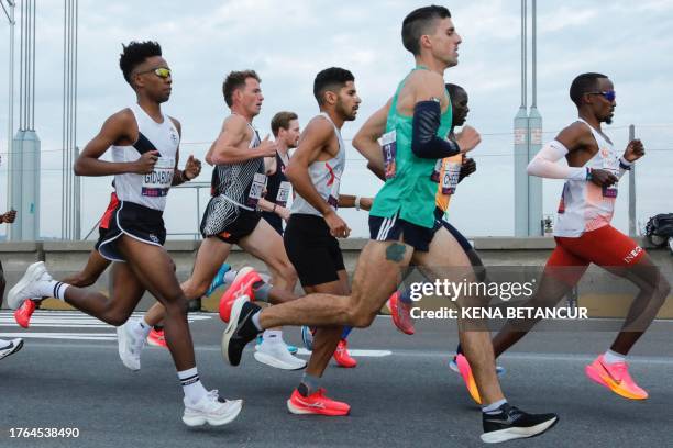 Runners cross the Verrazano Bridge before competing in the Men's division during the 52nd Edition of the New York City Marathon on November 5, 2023.