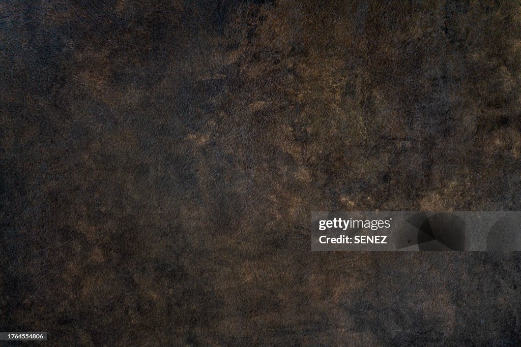 Abstract brown chocolate metallic background texture concrete or plaster hand made wall