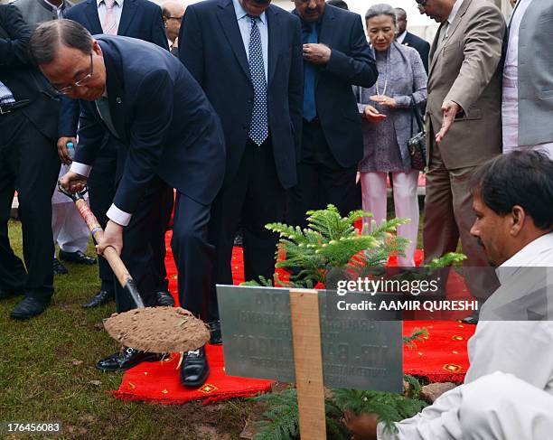 Secretary-General Ban Ki-moon plants a tree at the Islamabad College for Girls in Islamabad on August 13, 2013. UN chief Ban Ki-moon arrived in...