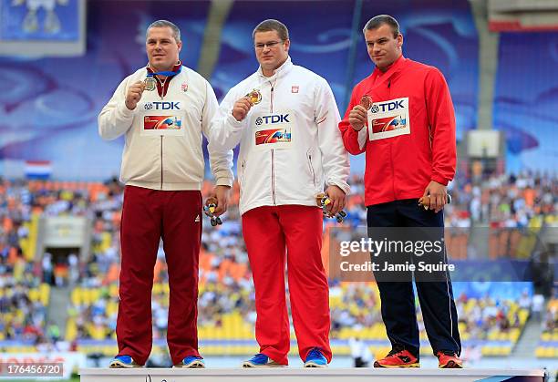 Silver medalist Krisztian Pars of Hungary, gold medalist Pawel Fajdek of Poland and bronze medalist Lukas Melich of the Czech Republic stand on the...