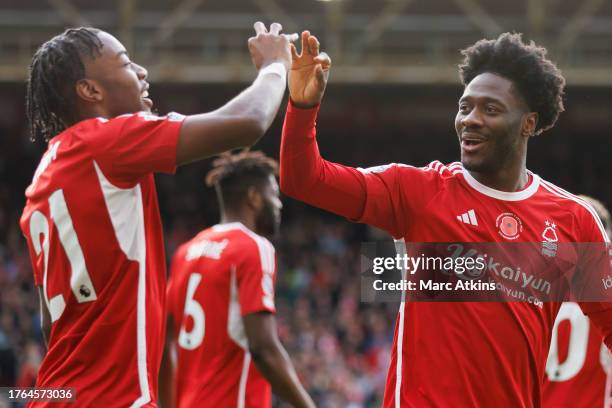 Ola Aina of Nottingham Forest celebrates scoring the opening goal with Anthony Elanga during the Premier League match between Nottingham Forest and...