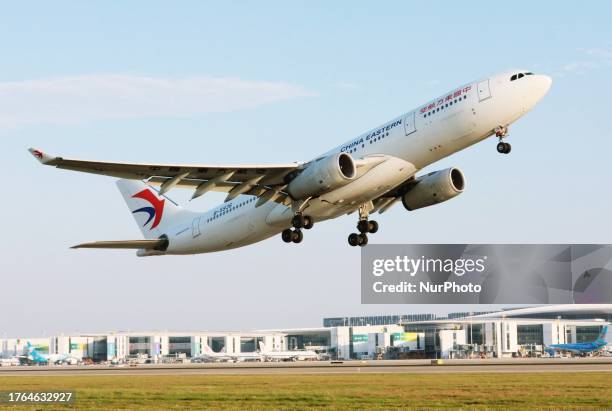 Passengers aboard an Airbus A330-200 of China Eastern Airlines Flight MU731 take off from Xiaoshan International Airport for a direct flight to...