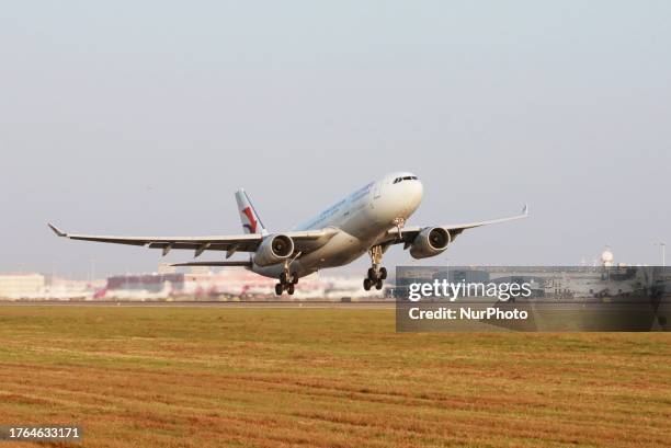 Passengers aboard an Airbus A330-200 of China Eastern Airlines Flight MU731 take off from Xiaoshan International Airport for a direct flight to...