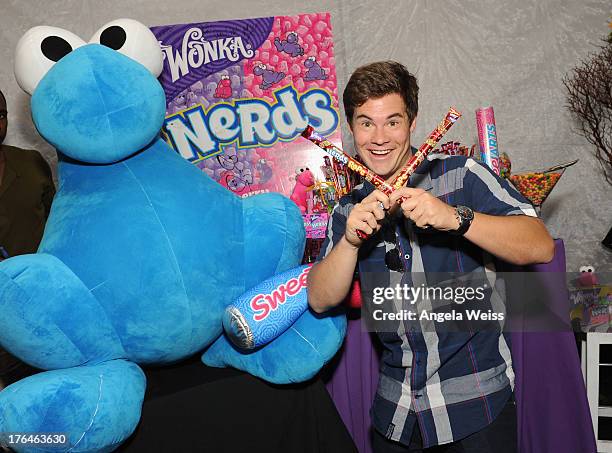 Adam DeVine attends the Backstage Creations Celebrity Retreat At Teen Choice 2013 - Day 2 at Gibson Amphitheatre on August 11, 2013 in Universal...