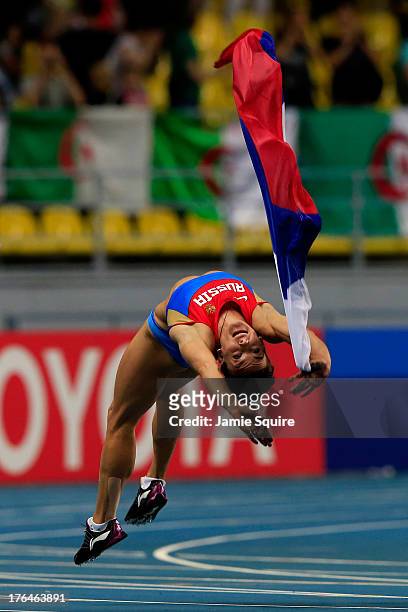 Elena Isinbaeva of Russia celebrates winning gold in the Women's pole vault final during Day Four of the 14th IAAF World Athletics Championships...