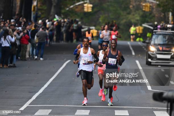 Kenya's Albert Korir and Ethiopia's Tamirat Tola compete in the 52nd Edition of the New York City Marathon on November 5, 2023.