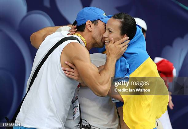 Oleksiy Kasyanov of Ukraine congratulates Hanna Melnychenko of Ukraine on winning gold in the heptathlon during Day Four of the 14th IAAF World...