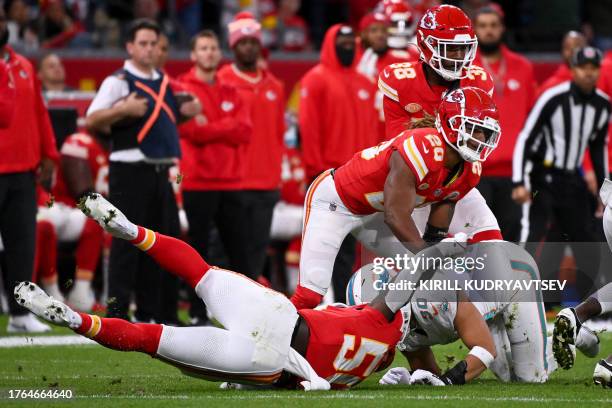 Kansas City Chiefs linebacker Willie Gay and Miami Dolphins fullback Alec Ingold vie during the NFL game between Miami Dolphins and Kansas City...