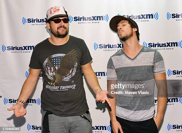 Rock band "10 Years" members Ryan "Tater" Johnson and Jesse Hasek visit SiriusXM Studios on August 13, 2013 in New York City.