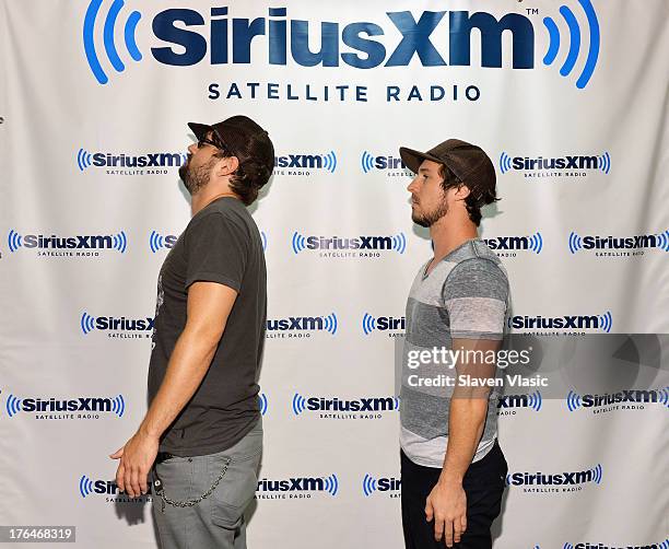 Rock band "10 Years" members Ryan "Tater" Johnson and Jesse Hasek visit SiriusXM Studios on August 13, 2013 in New York City.