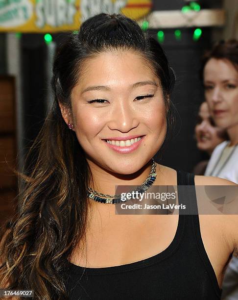 Actress Jenna Ushkowitz poses in the green room at the 2013 Teen Choice Awards at Gibson Amphitheatre on August 11, 2013 in Universal City,...