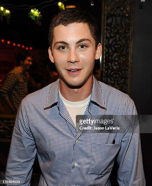 Actor Logan Lerman poses in the green room at the 2013 Teen Choice Awards at Gibson Amphitheatre on August 11, 2013 in Universal City, California.