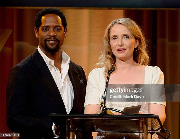 Actors Blair Underwood and Julie Delpy speak onstage at the Hollywood Foreign Press Association's 2013 Installation Luncheon at The Beverly Hilton...