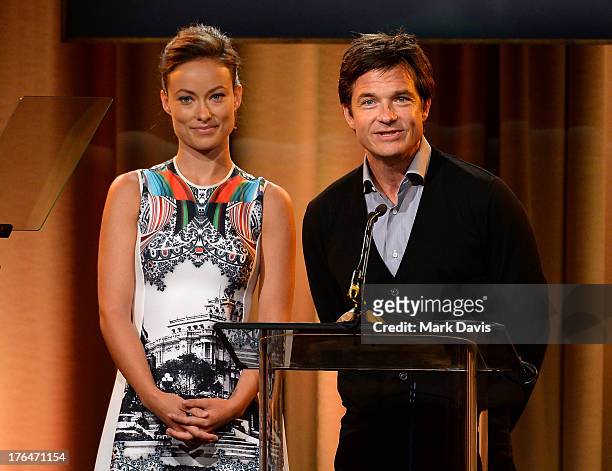 Actors Olivia Wilde and Jason Bateman speak onstage at the Hollywood Foreign Press Association's 2013 Installation Luncheon at The Beverly Hilton...