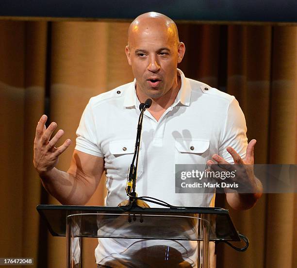 Actor Vin Diesel speaks onstage at the Hollywood Foreign Press Association's 2013 Installation Luncheon at The Beverly Hilton Hotel on August 13,...