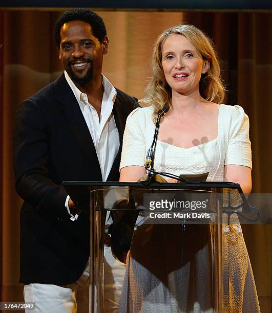 Actors Blair Underwood and Julie Delpy speak onstage at the Hollywood Foreign Press Association's 2013 Installation Luncheon at The Beverly Hilton...
