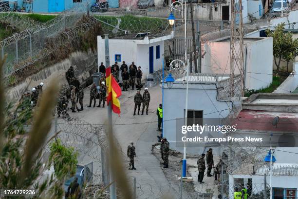 Spanish military officers guard the border crossing at the Benzu neighborhood after an attempted fence jump by around 200 migrants, Oct. 30 in Ceuta,...
