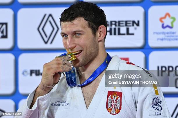 Georgia's Lasha Bekauri pose with his gold medal in the men's -90 kg during the European Judo Championships 2023 at the Sud de France Arena in...