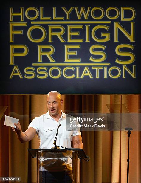 Actor Vin Diesel speaks onstage at the Hollywood Foreign Press Association's 2013 Installation Luncheon at The Beverly Hilton Hotel on August 13,...