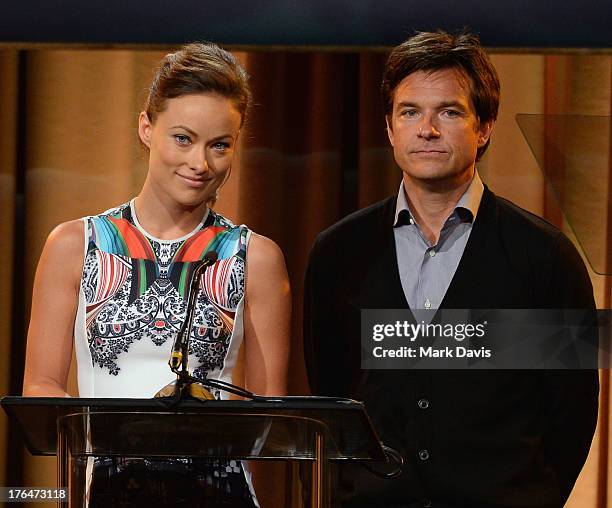 Actors Olivia Wilde and Jason Bateman speak onstage at the Hollywood Foreign Press Association's 2013 Installation Luncheon at The Beverly Hilton...