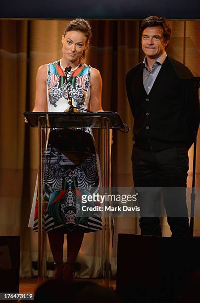 Actors Olivia Wilde and Jason Bateman speak onstage at the Hollywood Foreign Press Association's 2013 Installation Luncheon at The Beverly Hilton...