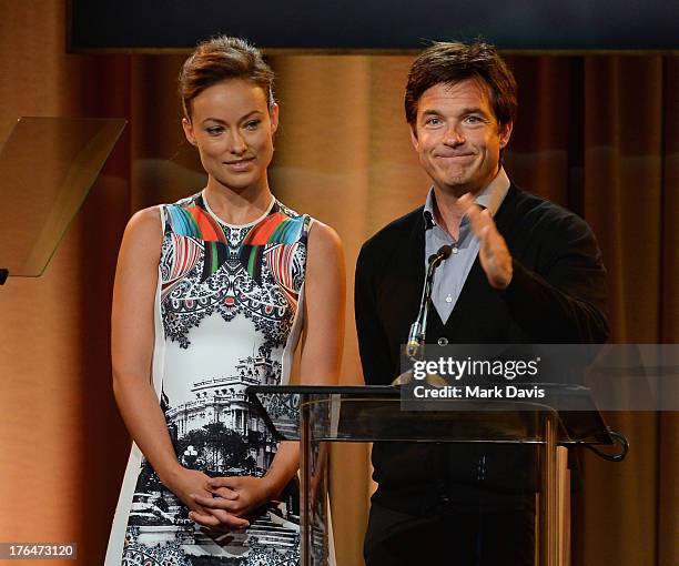 Actors Olivia Wilde and Jason Bateman speak onstage at the Hollywood Foreign Press Association's 2013 Installation Luncheon at The Beverly Hilton...