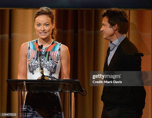 Actors Olivia Wilde and Jason Bateman speak onstage at the Hollywood Foreign Press Association's 2013 Installation Luncheon at The Beverly Hilton...